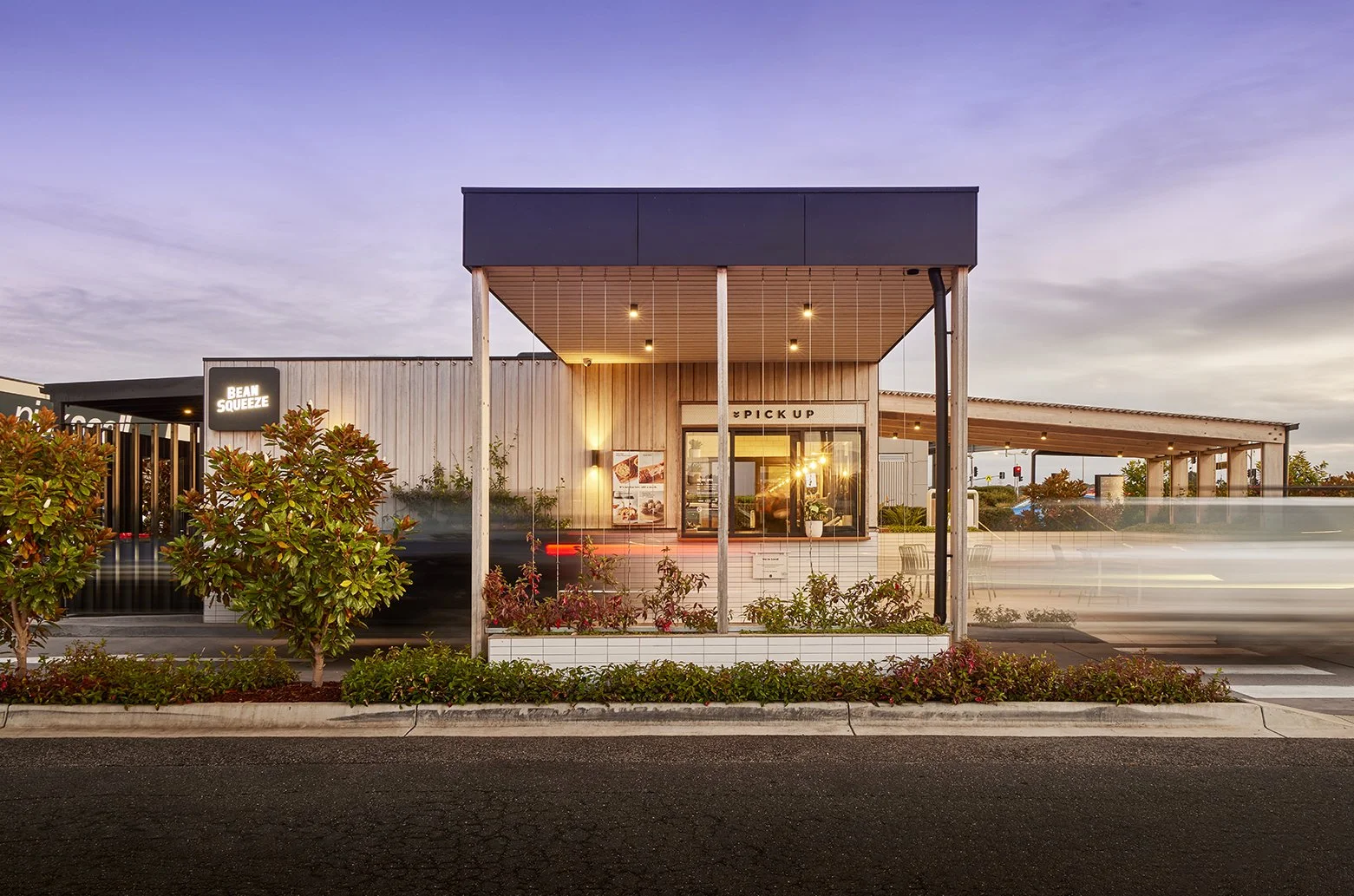 Bean Squeeze drive-thru store at dusk