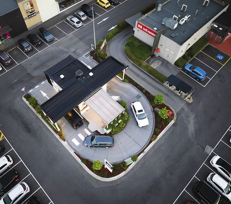 Aerial view of the Bean Squeeze Waurn Ponds Plaza store on a small pad site within a shopping centre car park